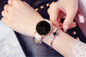 Minimalist white leather watch with black dial and gold clover bracelet jewelry set
