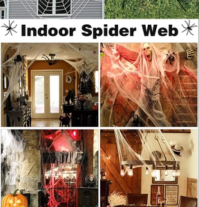 Indoor Halloween white spider web decor with small black spiders for haunted house scenes