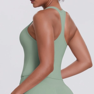 Detail view of the racerback design and breathable brushed fabric on a green sports vest