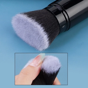 Portable large retractable foundation brush with dense bicolored nylon bristles and black handle