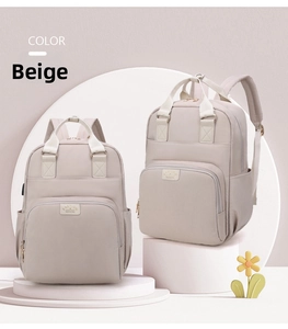 Close-up of beige waterproof nylon mommy backpack with Fashion brand label