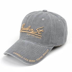 Detail of vintage gray washed baseball cap with gold Bourbon St. letter embroidery