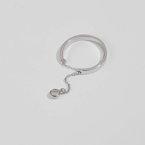 Close-up of S925 silver chain ring featuring a delicate round zircon pendant