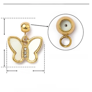 Detailed view of butterfly pendant with shell inlay and rubber stopper inside