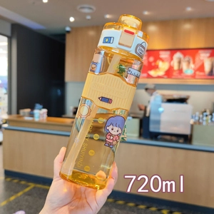 Close-up of 720ml square orange water bottle with straw, stickers and silicone sleeve