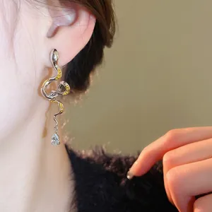 Chic silver snake stud earrings with yellow crystals and sparkling teardrop zircon stone
