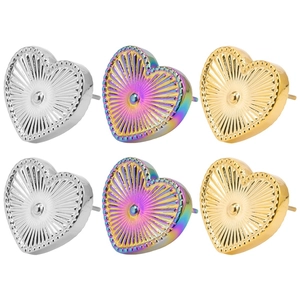 Detail of heart-shaped stainless steel earrings with radiant texture in gold and silver