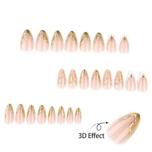 French style 3D golden press-on nails with bow and star patterns on nude pink base