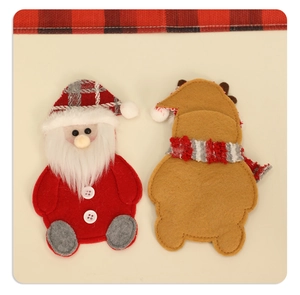 Detail of Christmas Santa and reindeer felt cutlery holders for festive table decor