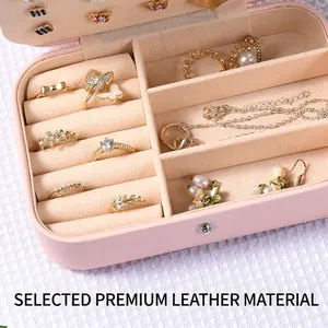 Pink faux leather travel jewelry box organizer with velvet lining and ring slots