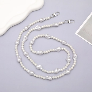 Elegant baroque pearl crossbody phone strap with silver lobster clasps on gray background
