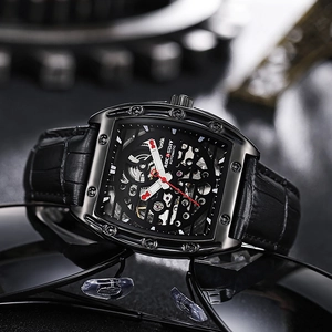Automatic mechanical tonneau watch with skeleton dial and black leather strap on sunglasses