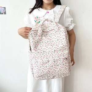 Fresh floral canvas backpack for college girls featuring pink and green flower patterns