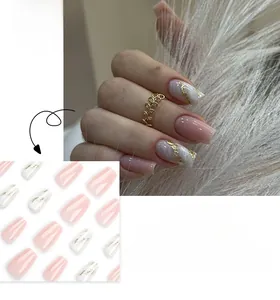 Macro detail of pink and white marble press-on nails with elegant gold foil accents