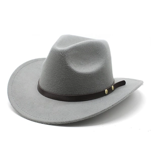 Detail of grey felt cowboy hat featuring brown leather band and gold rivet accents