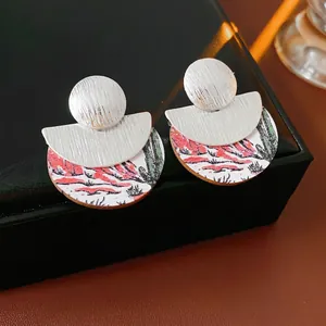 Bohemian silver geometric stud earrings with wooden cactus pattern and desert motif design