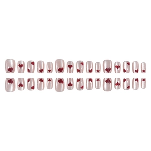 Short press-on nails with shimmering cat-eye finish and red heart patterns in 30 pieces set