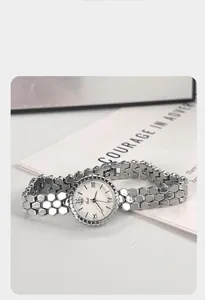 Close-up view of Gedi silver honeycomb alloy bracelet watch for women featuring bee logo dial