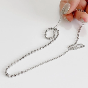 Asymmetric 925 sterling silver beaded choker necklace featuring a minimalist circular charm