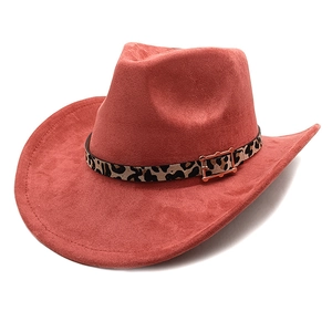 Detail of rust red suede cowboy hat featuring a leopard print belt and golden metal buckle