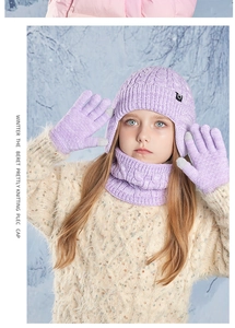 Close-up of lilac purple kids knitted winter set including hat, scarf and gloves