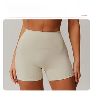Detailed close-up of high-waisted seamless beige sports shorts with push-up lifting effect