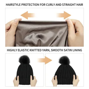 Elastic knit beanie with satin lining and faux fur pompom for hairstyle protection