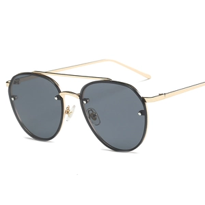 Classic aviator sunglasses with gold metal frame and grey lenses in a modern design