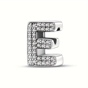 Detailed close-up of a silver-toned bead charm in letter E shape with pavé diamond settings