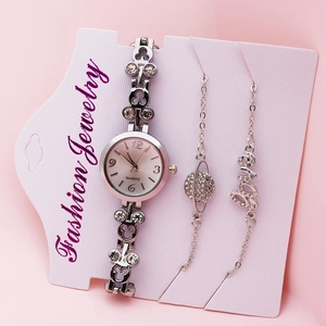 Close-up of elegant silver women's quartz watch with matching decorative bracelets