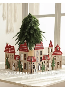 Detailed view of red wooden fence screen with Christmas tree and snowman cutouts