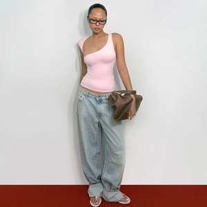 Pink one-shoulder slim fit tank top styled with light blue jeans for a modern chic look