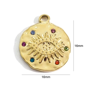 Detail of 16mm gold-plated Evil Eye pendant with colorful crystals and vintage texture