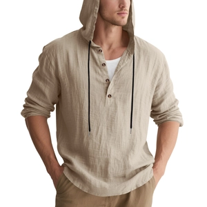 Detail of men's linen hooded shirt with wood-style buttons and black drawstring