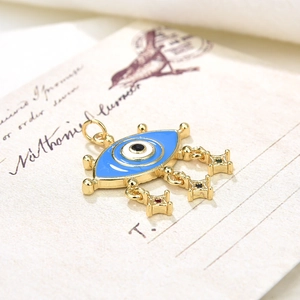 Vintage gold necklace with turquoise evil eye pendant and star fringe details