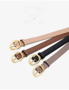 Detailed view of genuine leather belts with stylish matte gold buckles in various colors