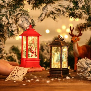 Close-up of LED Christmas lanterns with Santa and reindeer motifs in warm festive setting