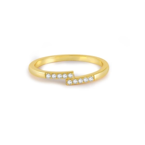 Detailed view of bypass golden ring featuring ten round-cut sparkling zirconias