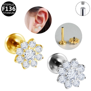 Detailed view of sterile G23 titanium floral labret stud with internal thread and zircons