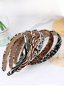 Close-up of assorted animal print headbands including leopard and zebra fabric patterns