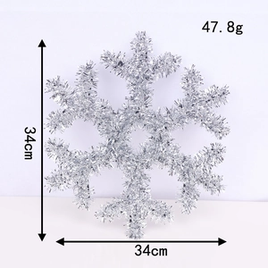 Detail view of a 34cm silver sequin snowflake ornament showing exact size and dimensions