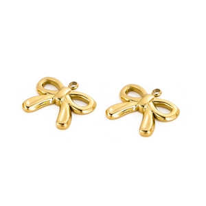 Macro detail of two gold-plated stainless steel bow pendants with polished mirror finish