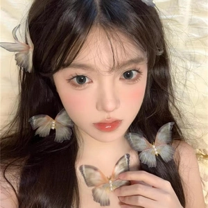 Elegant mesh butterfly hair clips with pearls shown on model in gradient pastel colors