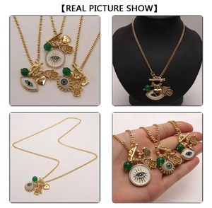 Detailed view of gold Evil Eye and Hamsa Hand charms on a layered bead necklace