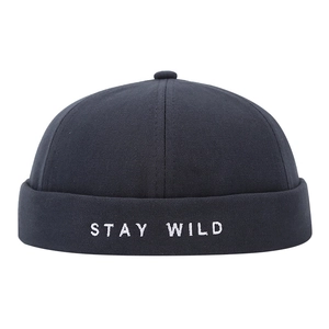 Retro black docker hat with white STAY WILD embroidery on high-quality canvas fabric