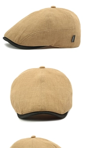 Gros plan sur la casquette plate kaki à texture gaufrée avec bordure noire et étiquette