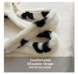 Macro shot of fluffy cow print plush shoulder strap with soft faux fur texture