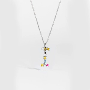 Detail of S925 sterling silver letter I necklace pendant with colorful zircon stones