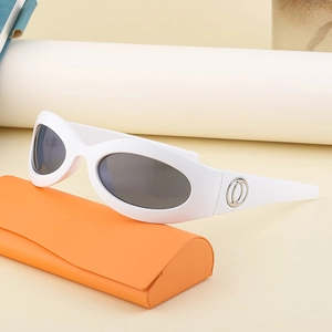 Y2K style white oval sunglasses with dark lenses and orange folding leather case