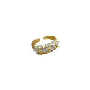 Adjustable gold open ring featuring square and marquise-cut cubic zirconia crystals